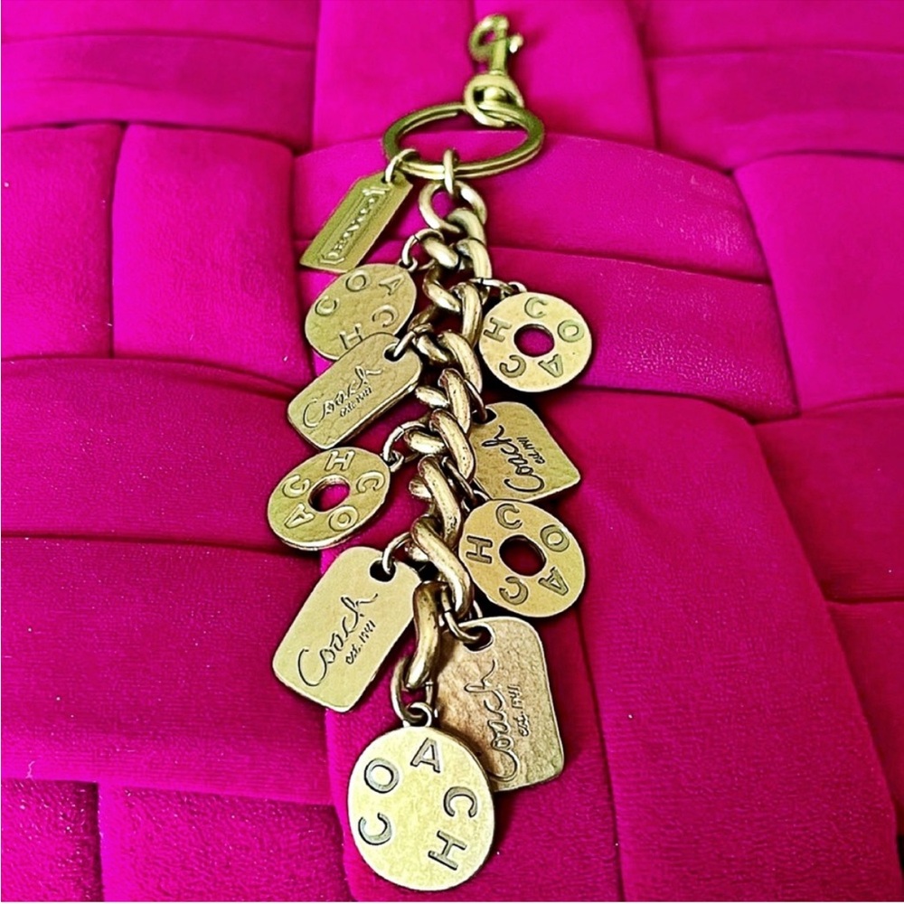 Coach vintage model #92124, featuring multiple hammered coin charms RARE!